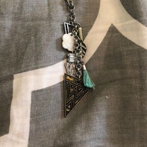 Long silver necklace with teal charm